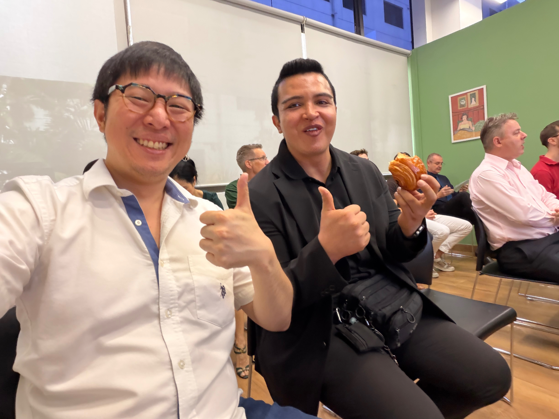 Sam with a founder at a Bangkok tech event